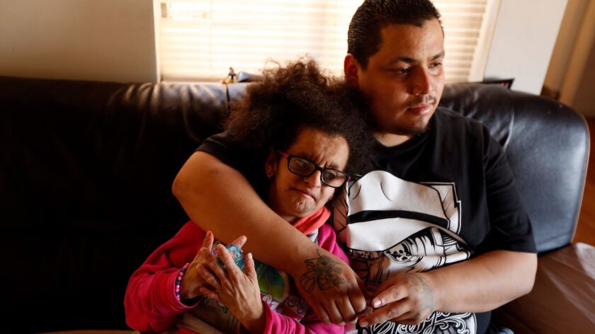 Jesus Alonso Arreola Robles, 22, spends time with his sister Maria Lupita Arreola, 16, who suffers from Progeria syndrome, in their family's apartment in North Hollywood in March.