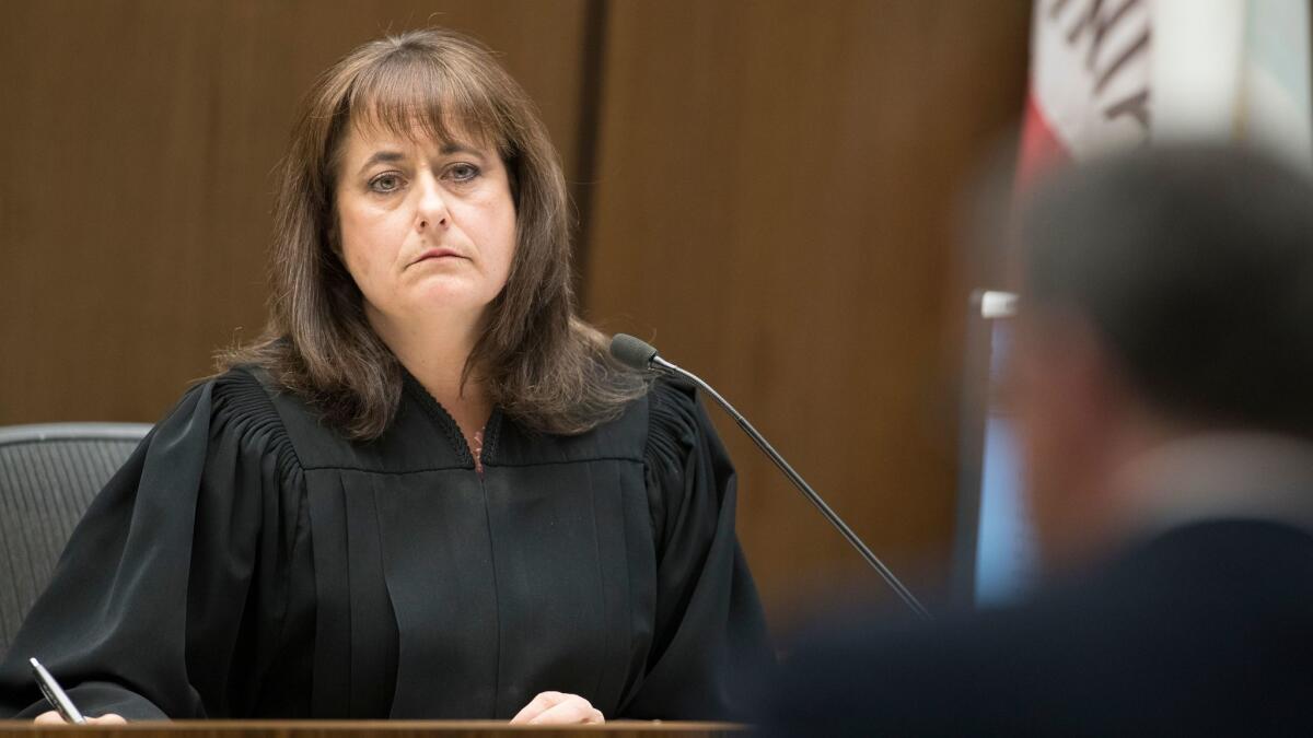 Judge Sheila Hanson listens during Samuel Woodward's arraignment Friday in Orange County Superior Court.