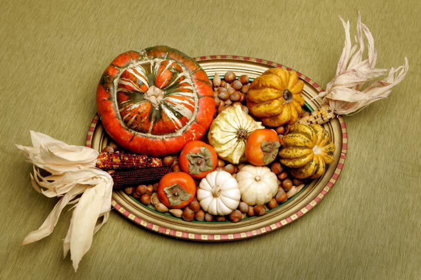On Thanksgiving, keep the centerpieces low so guests can easily see and talk with one another across the table.