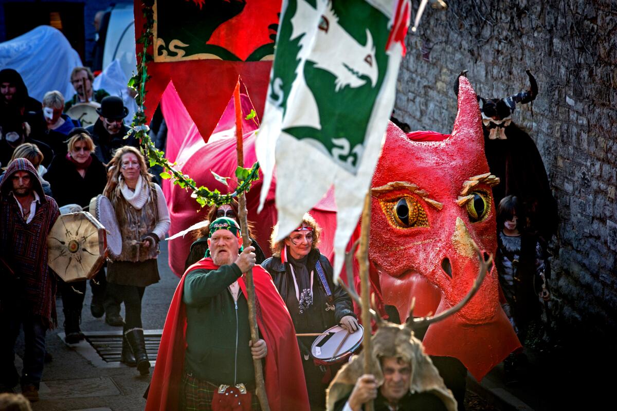 The Glastonbury Dragons are paraded through the town as they celebrate Samhain. 