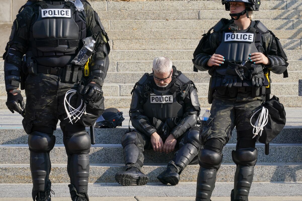 Police in riot gear outside the Kenosha County Court House in Wisconsin on Monday.