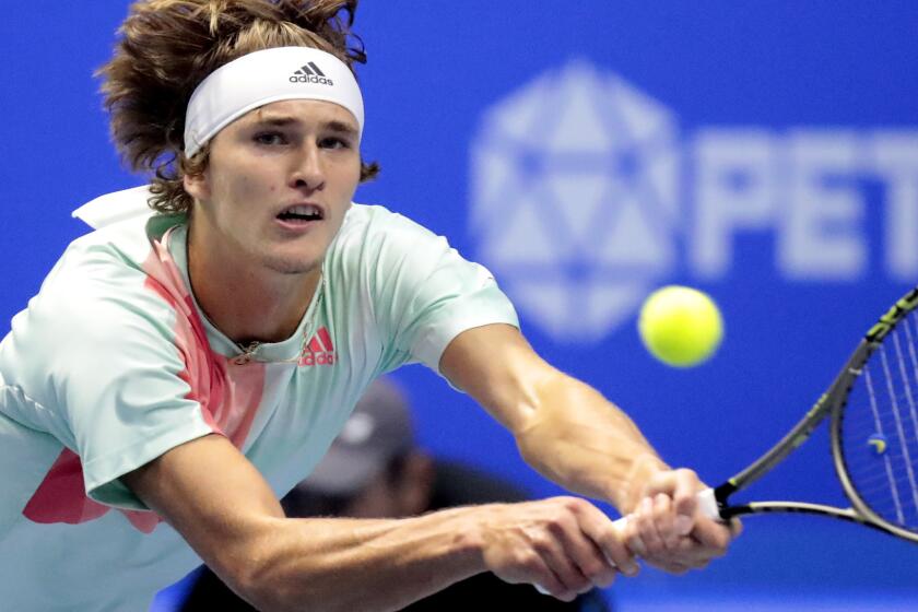 Alexander Zverev stretches to hit a backhand against Stan Wawrinka in the St. Petersburg Open final on Sunday.