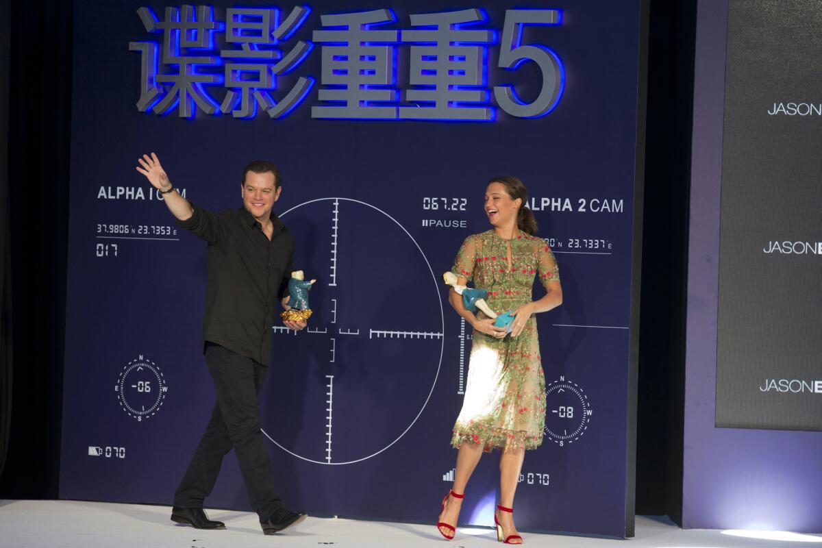 Matt Damon with Alicia Vikander during an Aug. 16 event to promote the release of "Jason Bourne" in China.