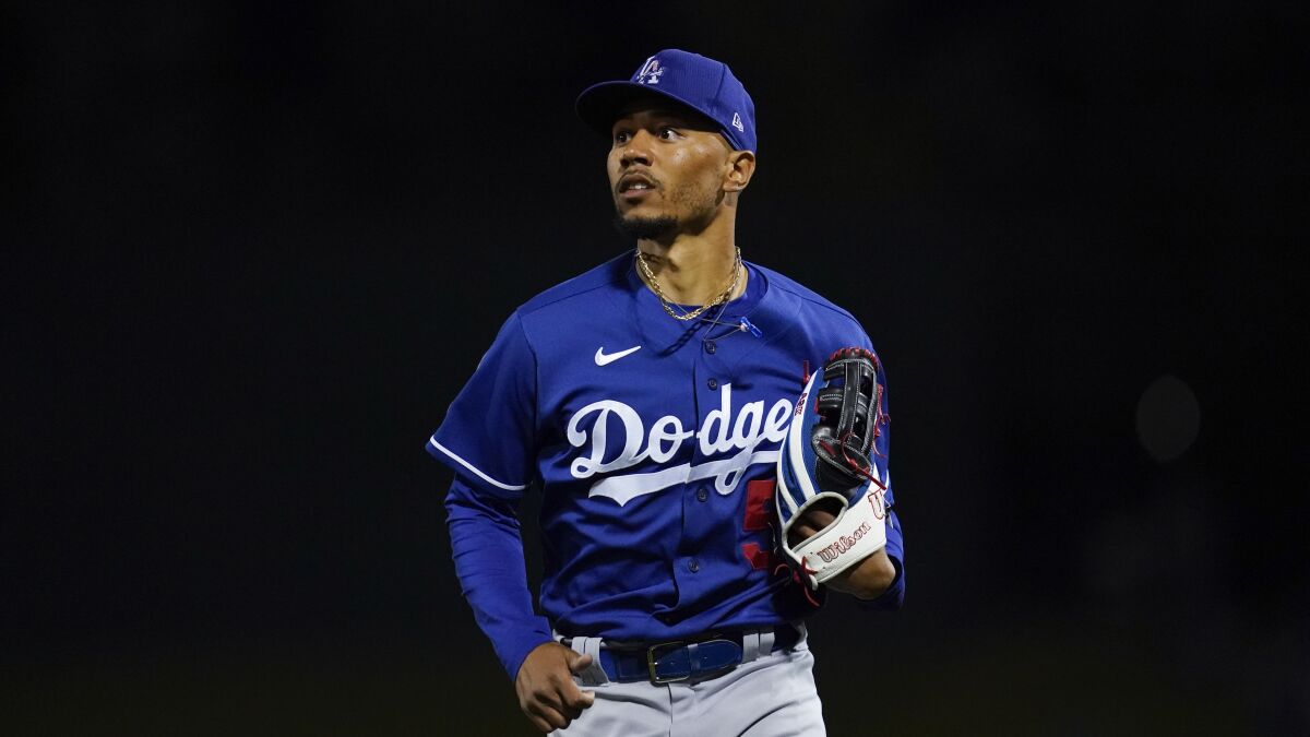 Los Angeles Dodgers right fielder Mookie Betts (50) runs to the dugout during a spring training baseball game.