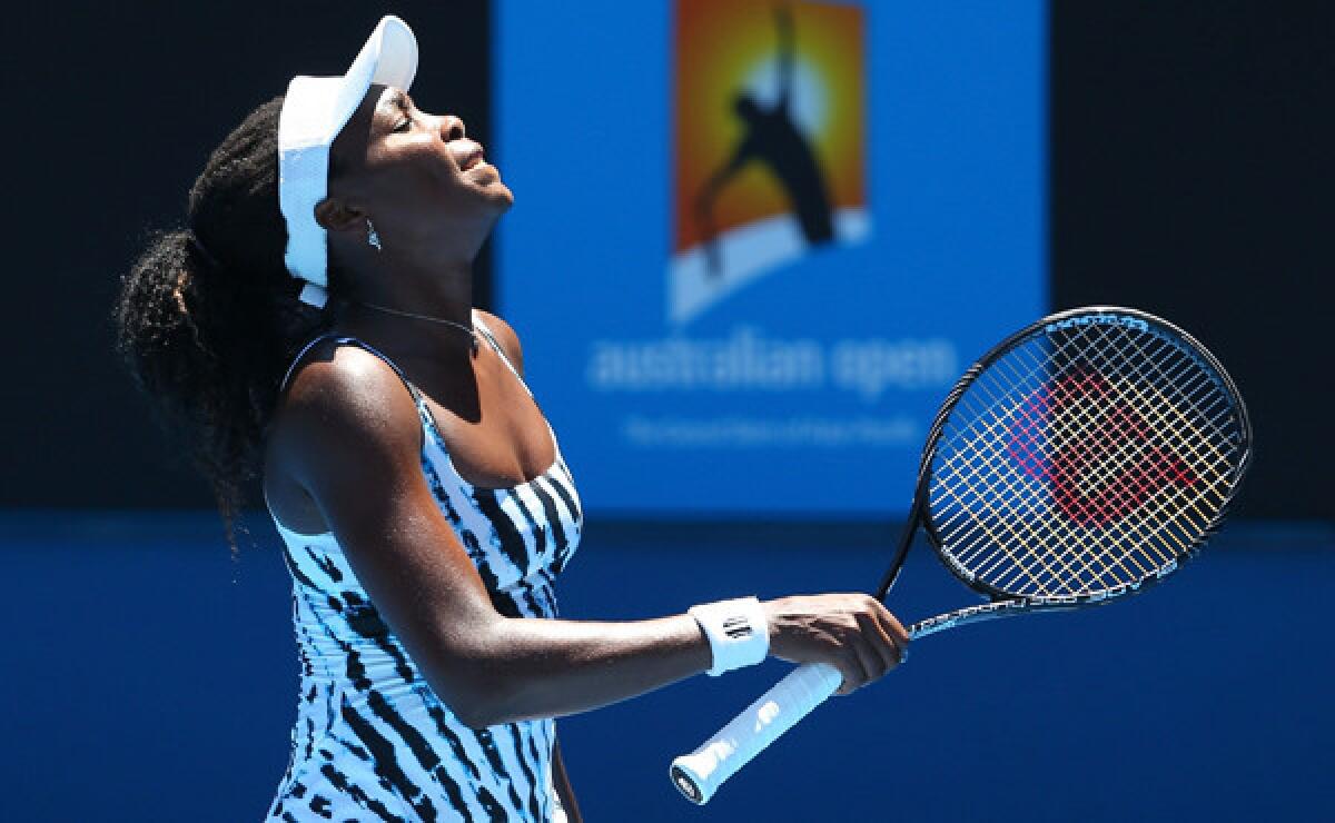 Venus Williams reacts during her first-round loss to Ekaterina Makarova at the Australian Open on Monday.