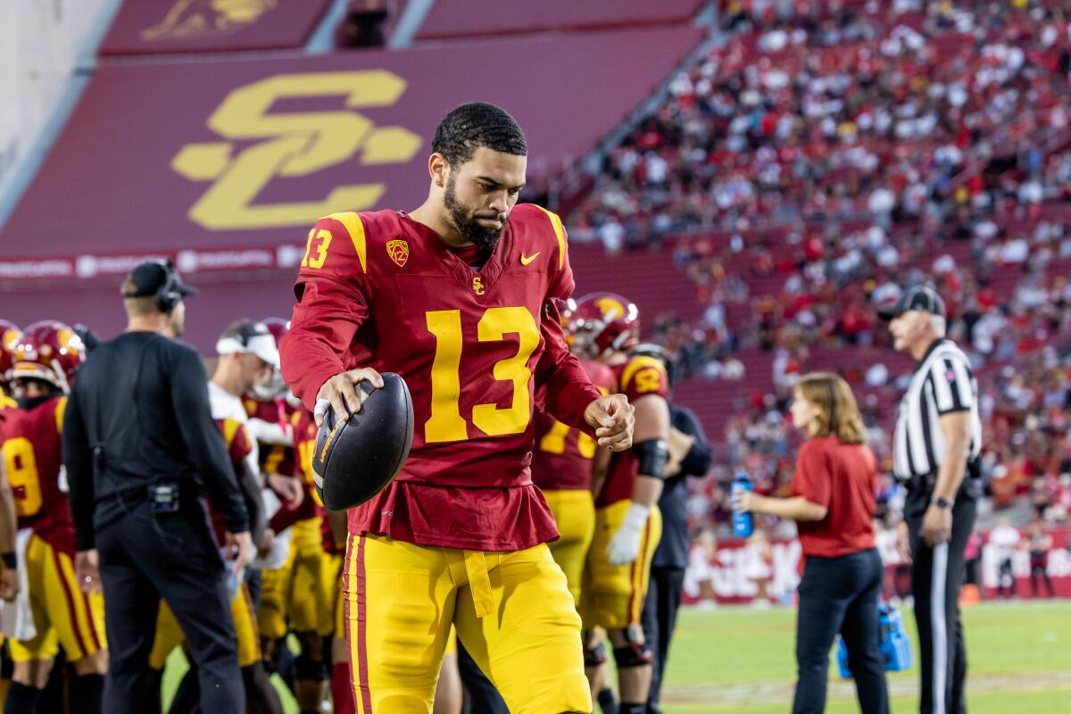 USC Trojans quarterback Caleb Williams stays loose during a timeout in a game against Utah.