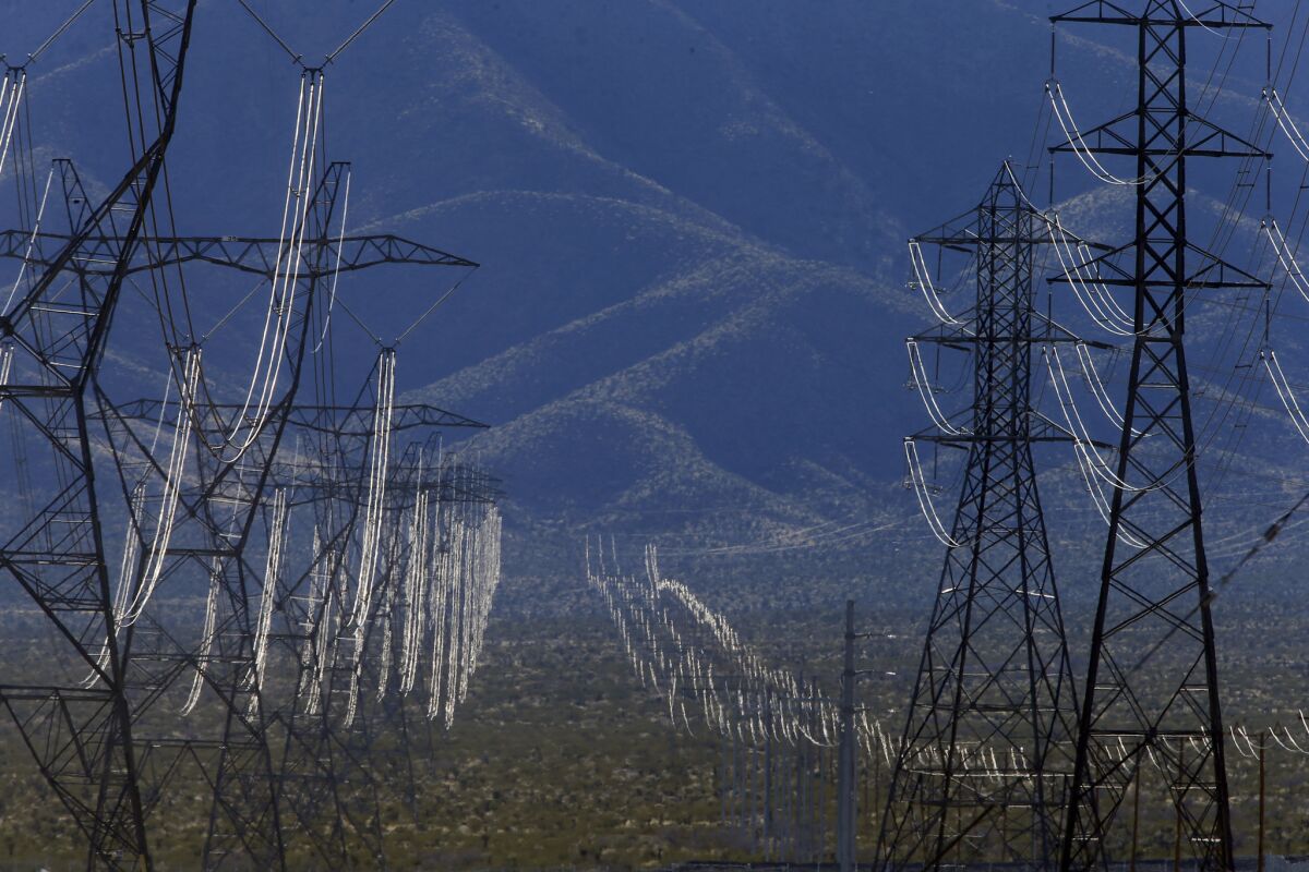 Electrical lines cross the Mojave Desert near the California-Nevada border.