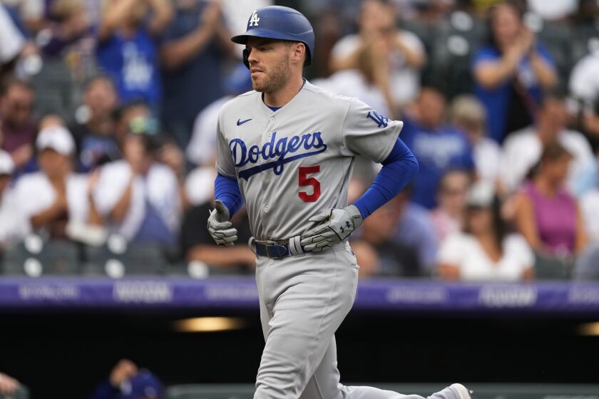Los Angeles Dodgers' Freddie Freeman runs the bases after hitting a solo home run off Colorado Rockies starting pitcher German Marquez during the first inning of a baseball game Wednesday, June 29, 2022, in Denver. (AP Photo/David Zalubowski)