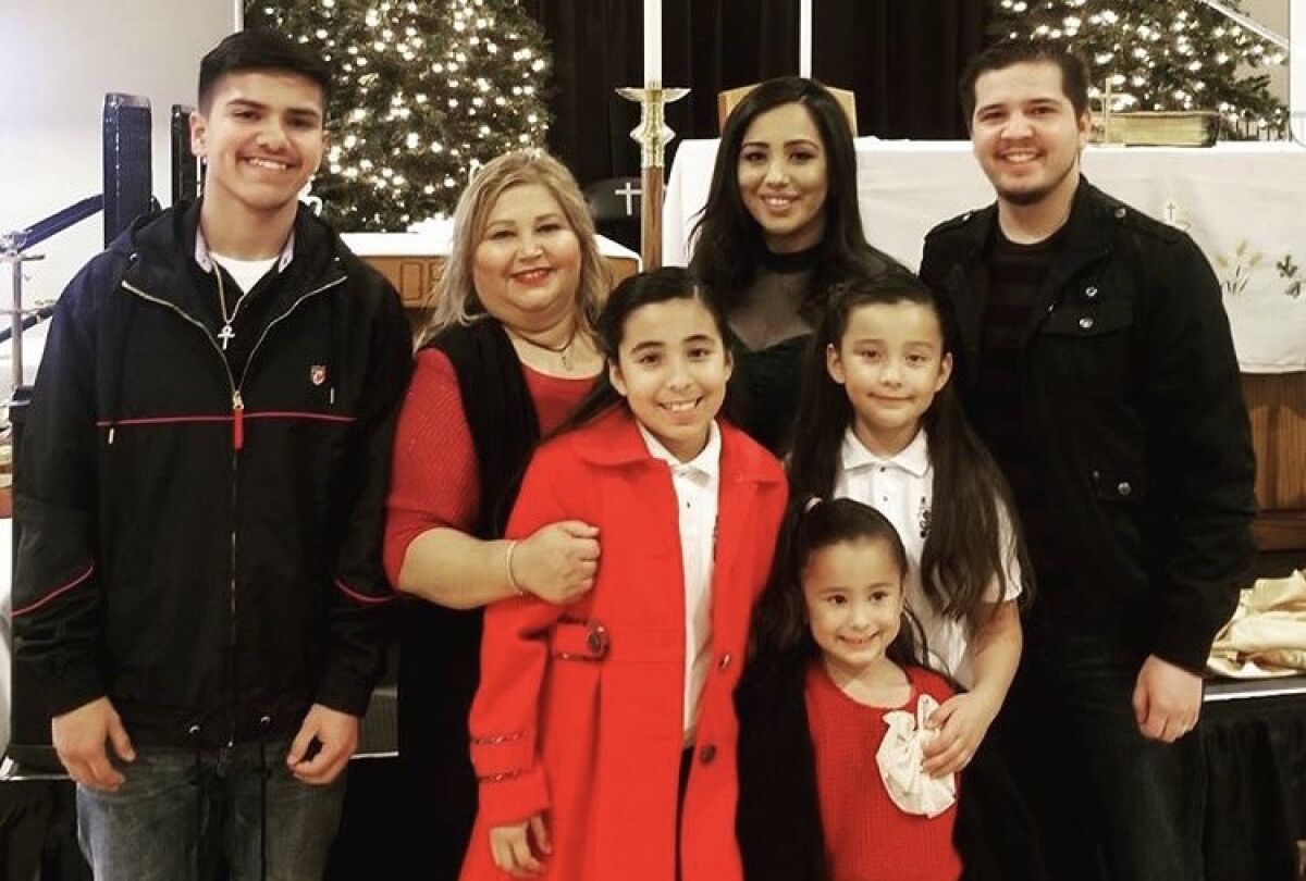 Susie Garcia, 52, with her three children and three of her grandchildren