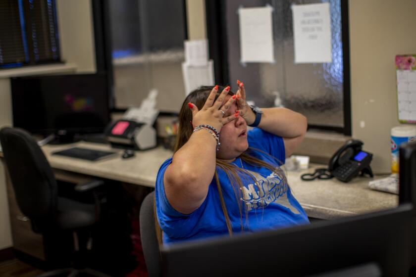 SAN ANTONIO, TX- JUNE 24, 2022: A staff member reacts after just hearing the news that the Supreme Court overturned Roe v. Wade shutting down abortion services at Alamo Women's Reproductive Services on June 24, 2022 in San Antonio, Texas. The clinic had to turn patients away once the ruling came down.(Gina Ferazzi / Los Angeles Times)