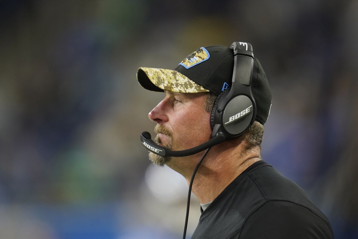 Detroit Lions head coach Dan Campbell watches from the sideline during the second half of an NFL football game against the Philadelphia Eagles, Sunday, Oct. 31, 2021, in Detroit. (AP Photo/Paul Sancya)