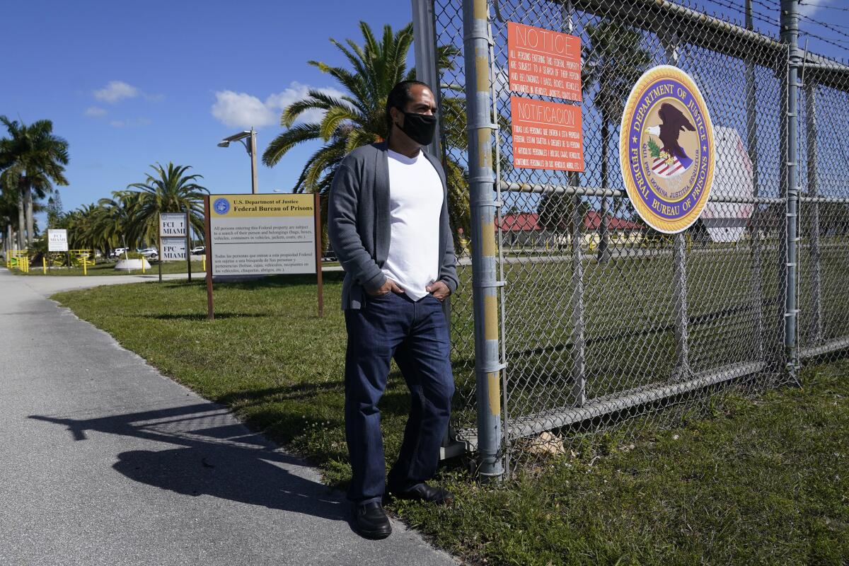 Kareen Troitino stands outside the Federal Corrections Institution, Friday, March 12, 2021, in Miami. Troitino, a local correction's officer union president, said that fewer than half of the facility's 240 employees have been fully vaccinated as of March 11. Many of the workers who refused had expressed concerns about the vaccine’s efficacy and side effects, Troitino said. (AP Photo/Marta Lavandier)