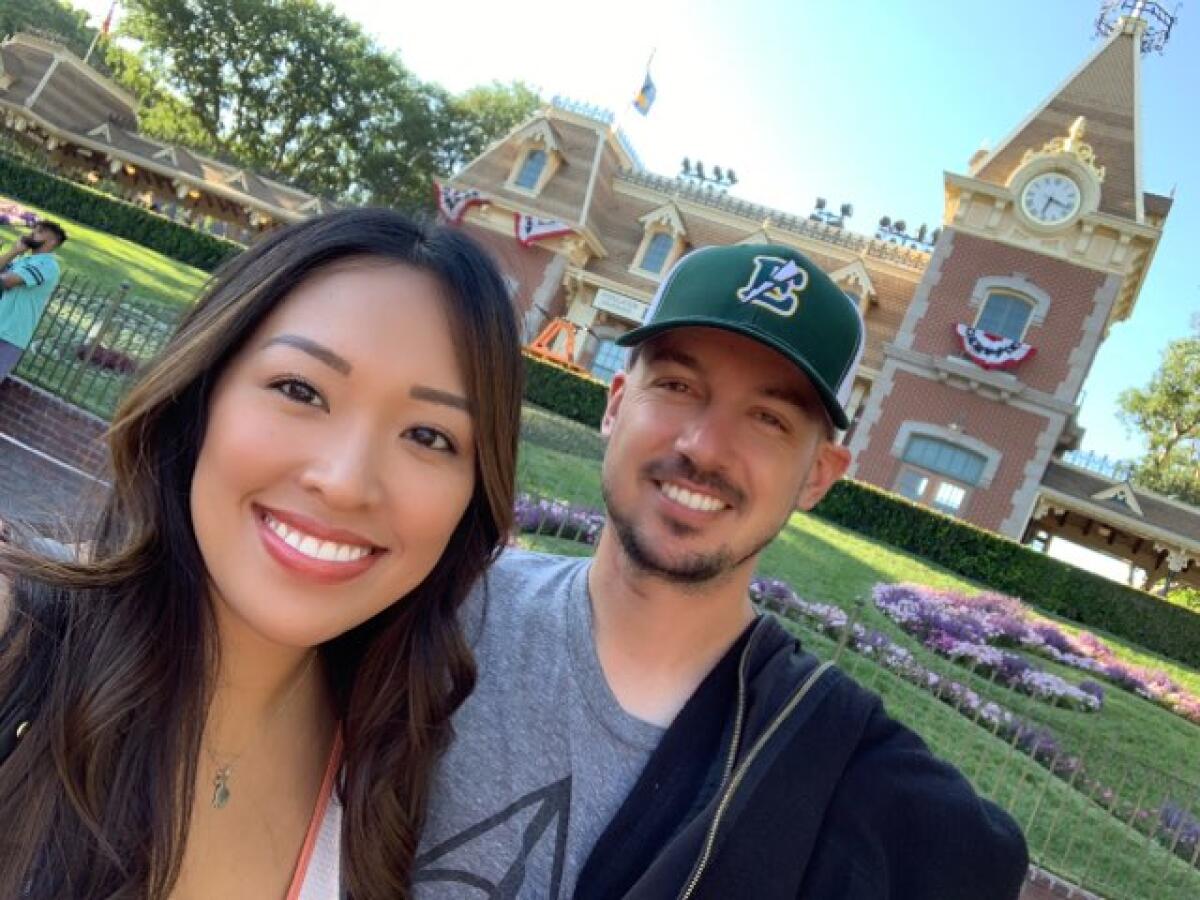 Aaron Pines, right, and his wife Deriah are pictured at Disneyland.