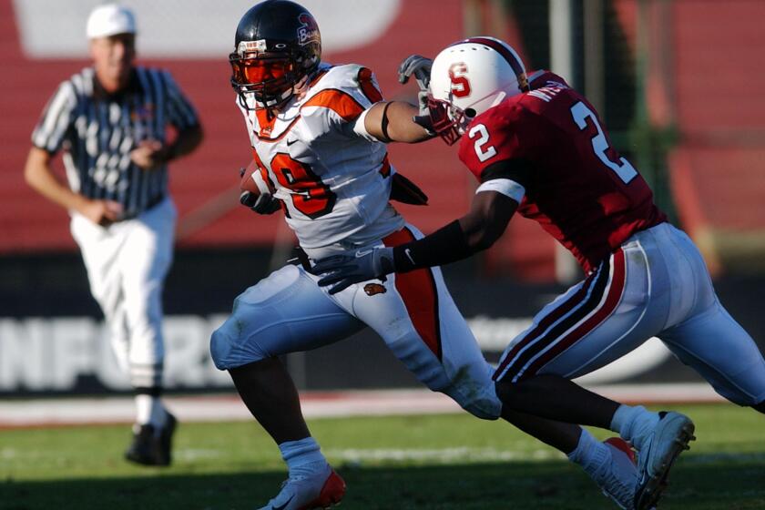 Oregon State running back Dwight Wright (29) runs past Stanford cornerback Stanley Wilson (2) during a game.