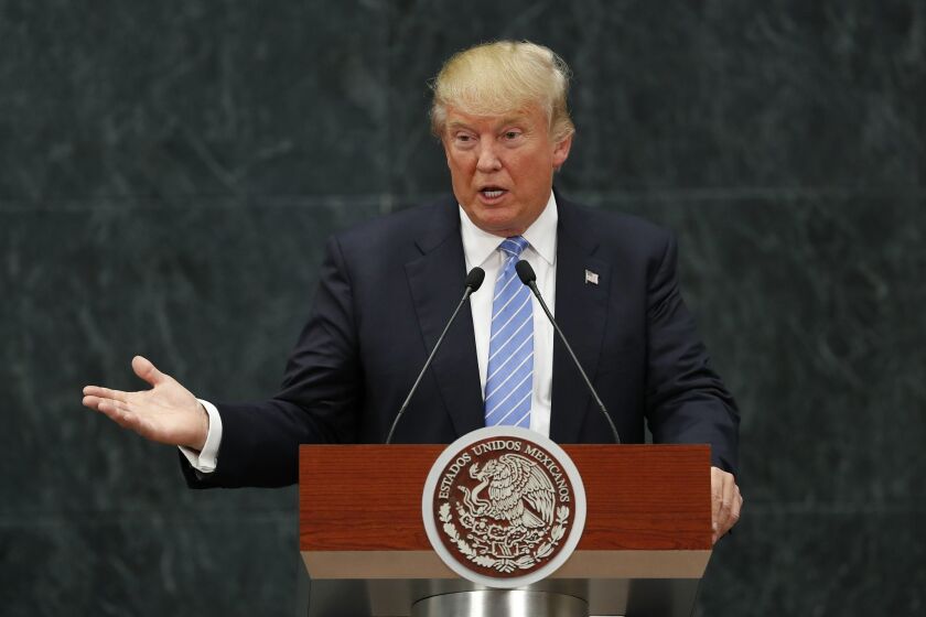 Republican presidential candidate Donald Trump speaks during a joint statement with Mexico's President Enrique Pena Nieto in Mexico City, Wednesday, Aug. 31, 2016. Trump is calling his surprise visit to Mexico City Wednesday a 'great honor.' The Republican presidential nominee said after meeting with Peña Nieto that the pair had a substantive, direct and constructive exchange of ideas.(AP Photo/Dario Lopez-Mills)