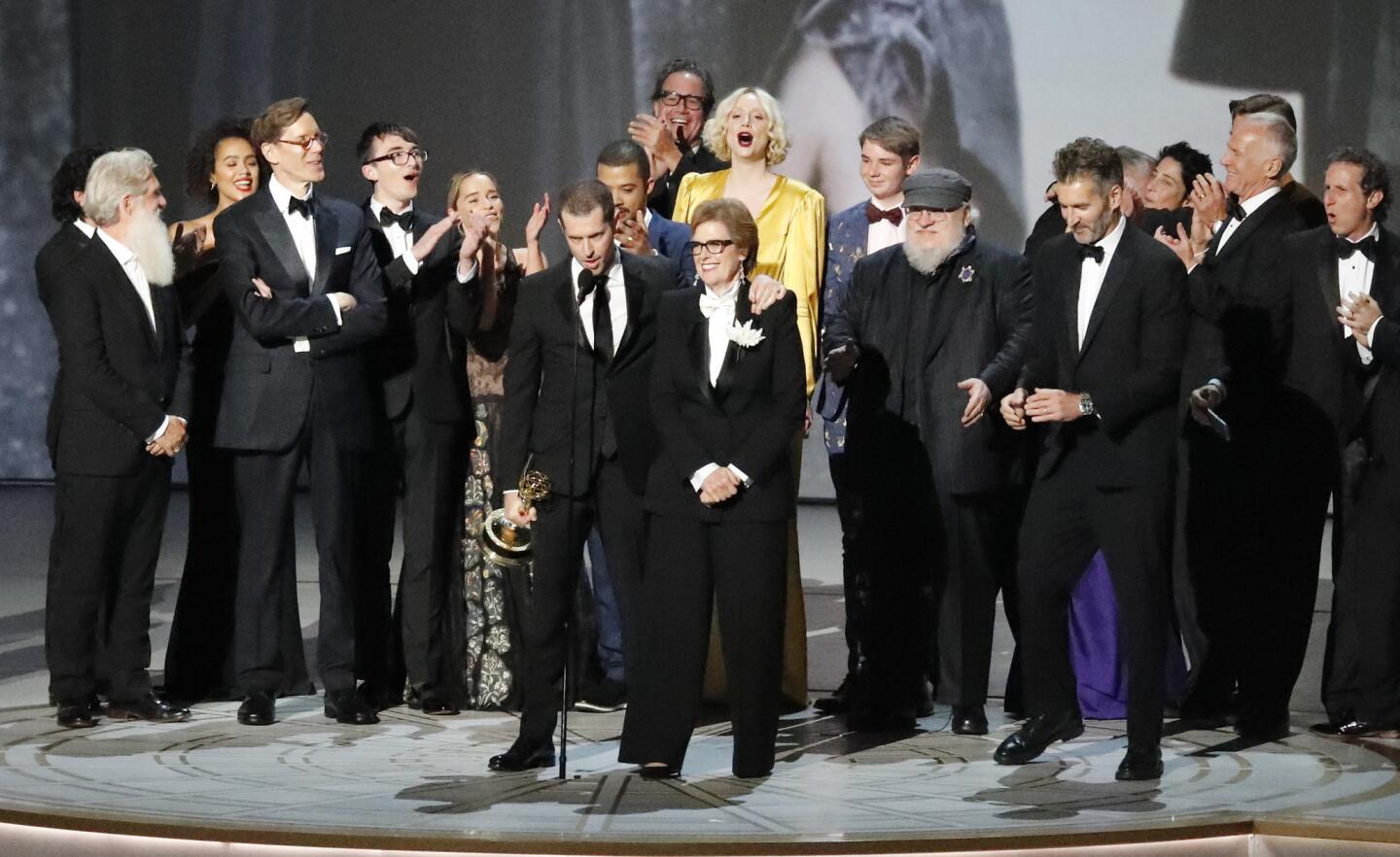 The cast and crew of "Game of Thrones" on stage accepting the outstanding drama series award during the show at the 70th Primetime Emmy Awards.