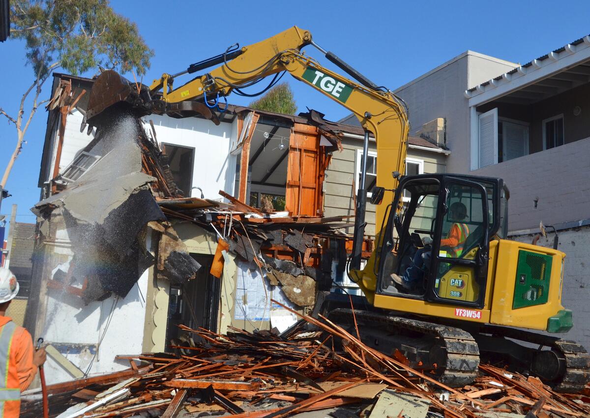 Tight quarters warranted a "mini excavator" to demolish 224 Marine Ave. 