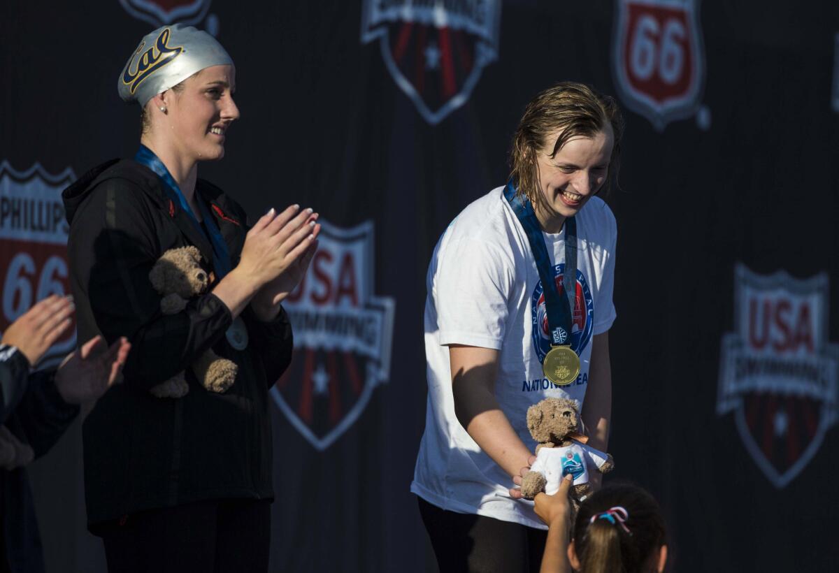 Missy Franklin, left, and Katie Ledecky on the medals platform after Ledecky won the 200-meter freestyle at the U.S. national championships in Irvine last August. Franklin came in second.