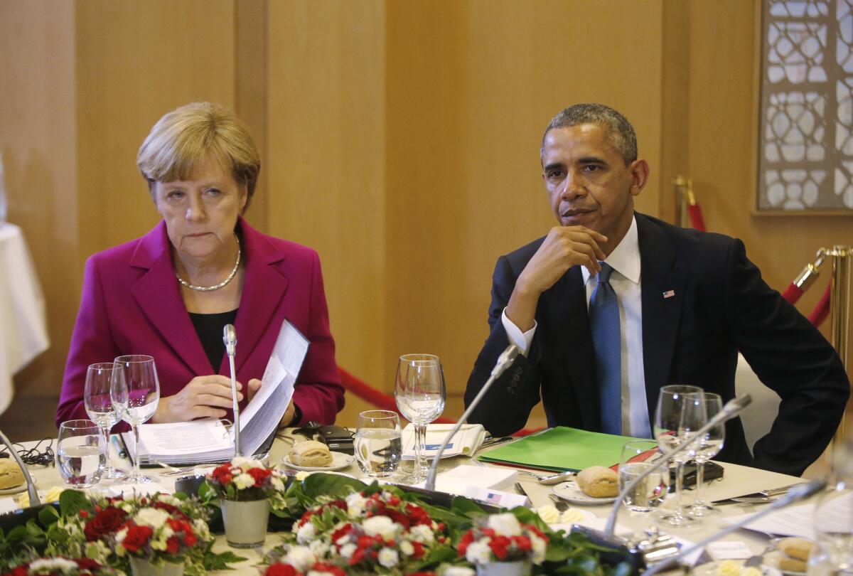 President Obama, right, and German Chancellor Angela Merkel were seated together at a G7 working dinner in Brussels, Belgium.