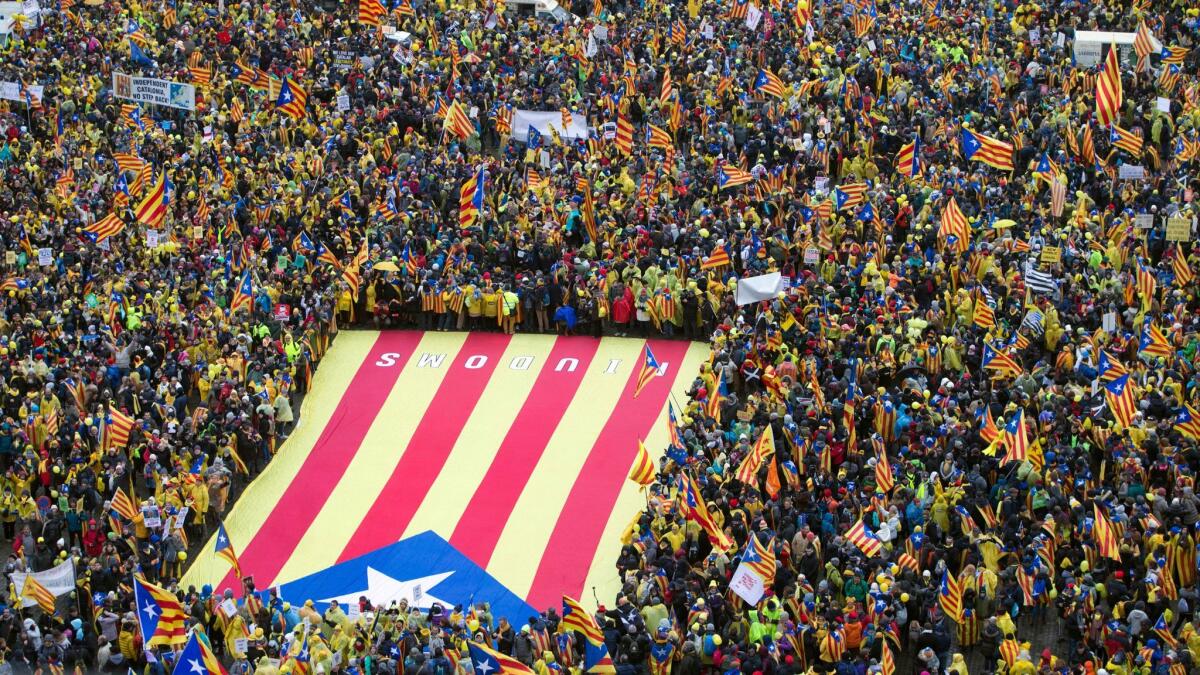 Pro-independence Catalan supporters gather to begin a demonstration near the EU quarter in Brussels on Thursday , Dec. 7, 2017. Thousands of Pro-Catalan supporters rallied in Brussels two weeks before Spanish regional elections.