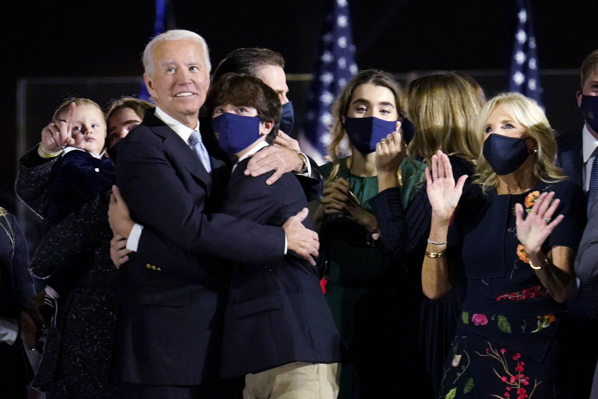 President-elect Joe Biden and Jill Biden watch fireworks after speaking Nov. 7 in Wilmington, Del.