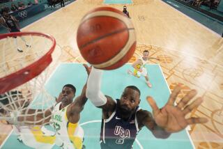 United States' LeBron James, right, is challenged by Brazil's Georginho de Paula during a men's quarterfinal game at Bercy Arena at the 2024 Summer Olympics, Tuesday, Aug. 6, 2024, in Paris, France. (AP Photo/Michael Conroy, Pool)