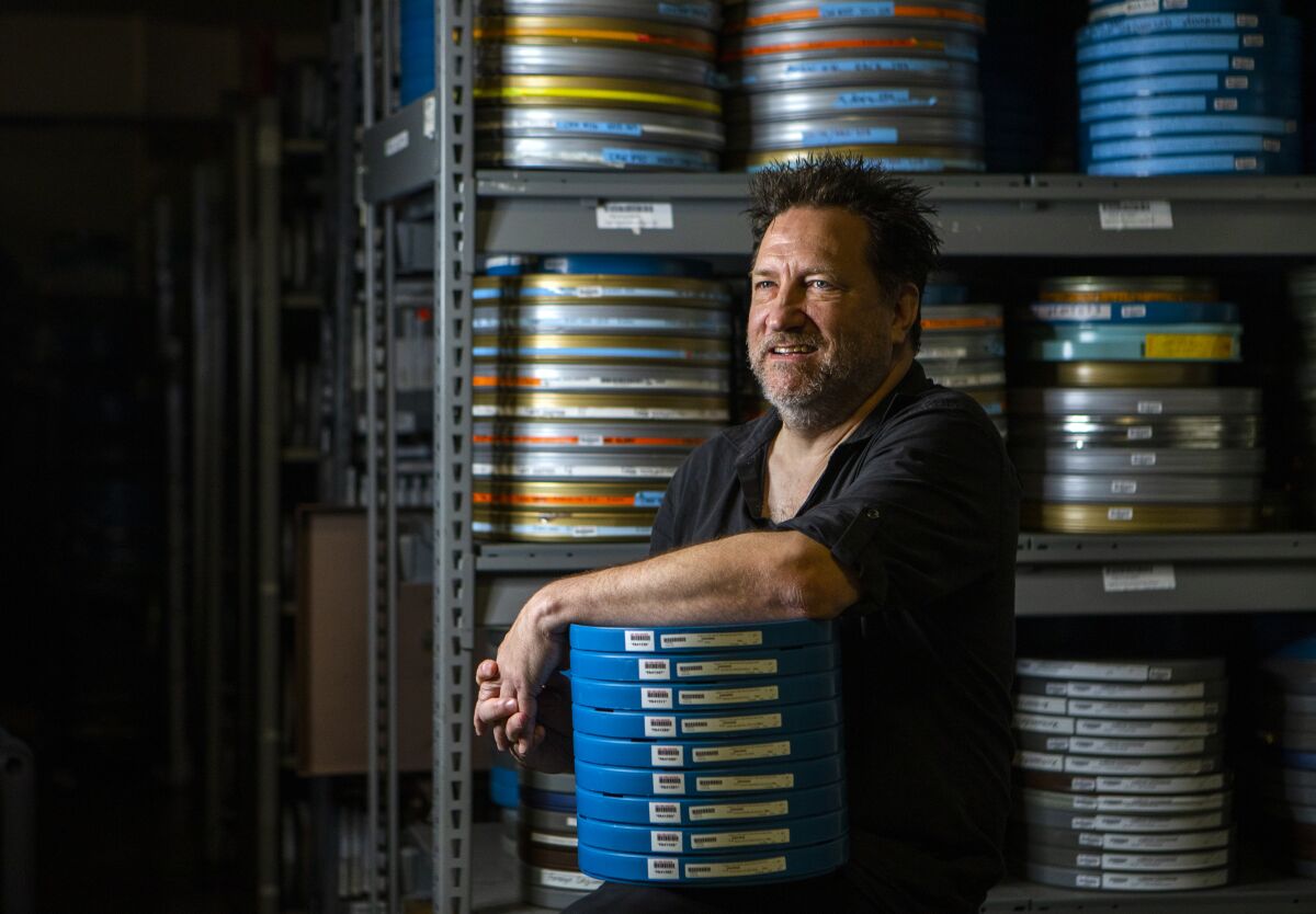Archivist Dino Everett in a temperature-controlled storage facility at USC.