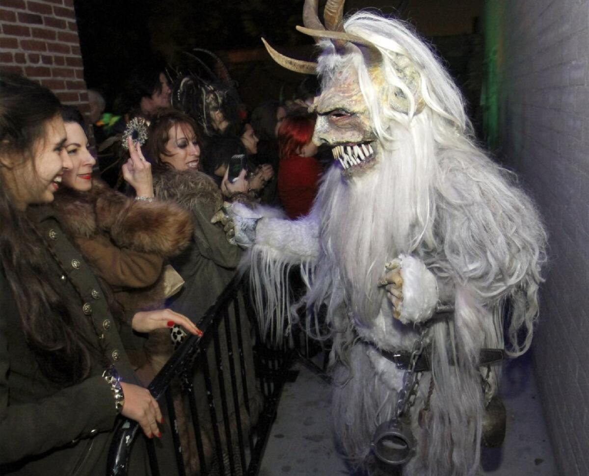 Party-goers have fun with a Krumpus during Christmas-themed Rammstein tribute Krampus Rumpus at the Complex in Glendale.