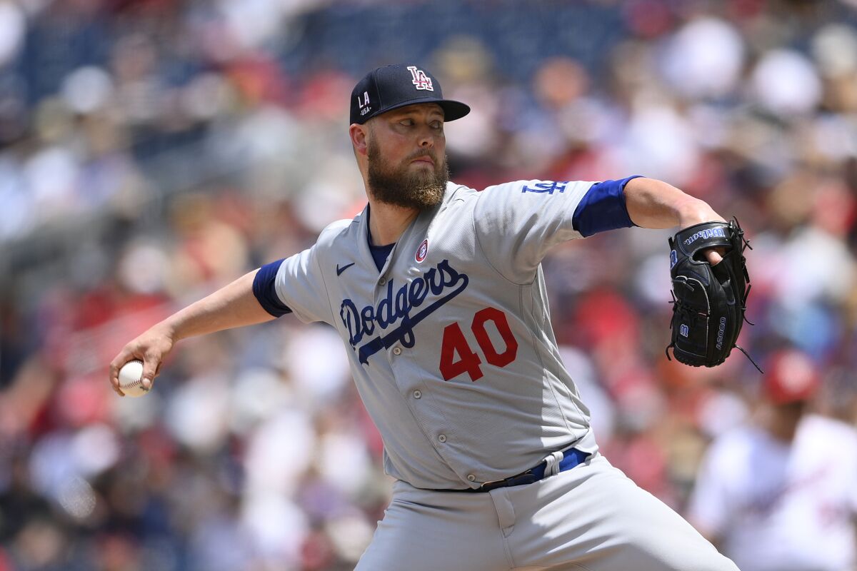 Dodgers starting pitcher Jimmy Nelson delivers a pitch against the Washington Nationals in July 2021.