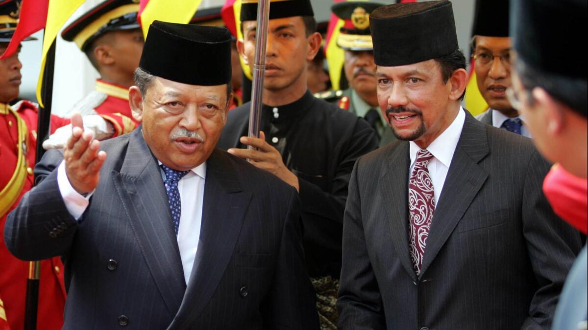 Brunei's Sultan Hassanal Bolkiah, right, shown with Malaysian Sultan Syed Sirajuddin in Kuala Lumpur in 2005, has ruled the tiny oil-rich Asian kingdom for more than five decades.