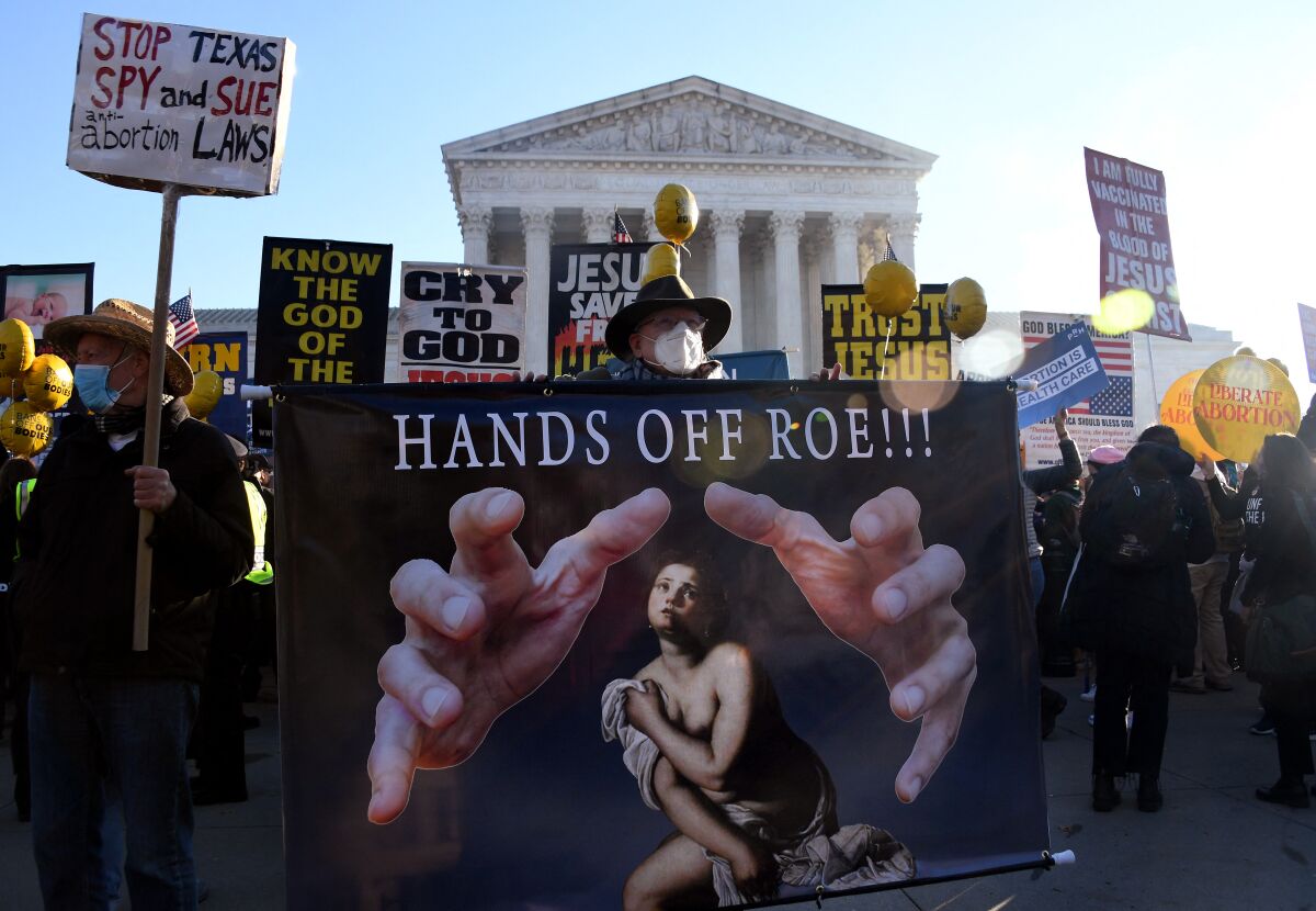 Abortion rights advocates and anti-abortion protesters demonstrate in front of the U.S. Supreme Court