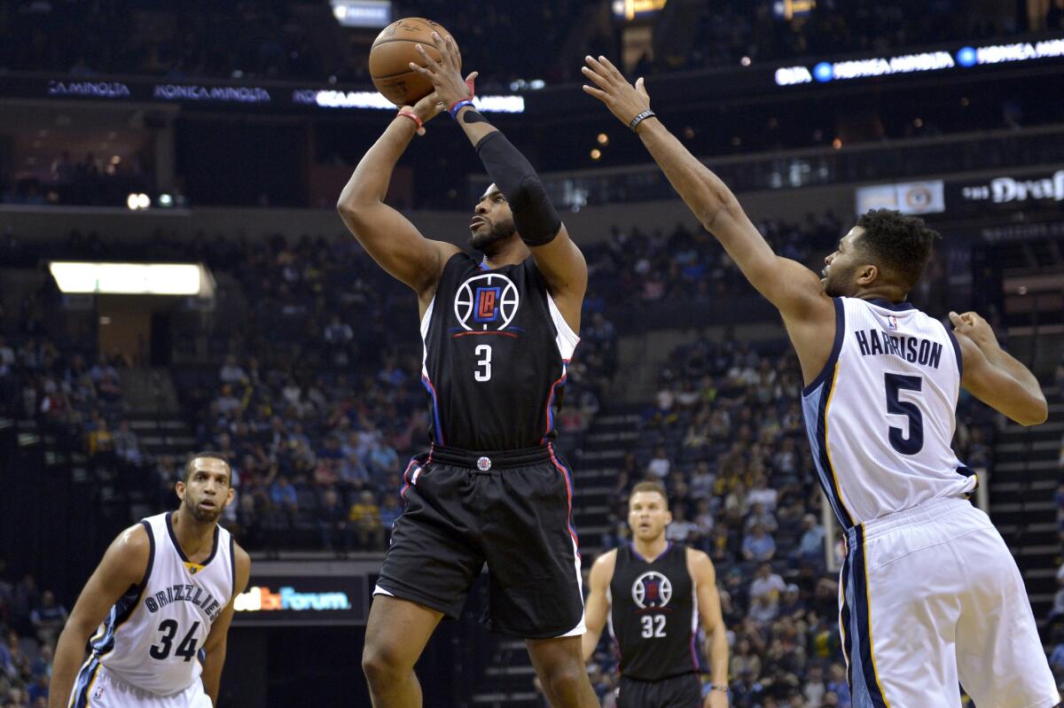 Clippers point guard Chris Paul pulls up for a shot against Grizzlies guard Andrew Harrison during the first half.