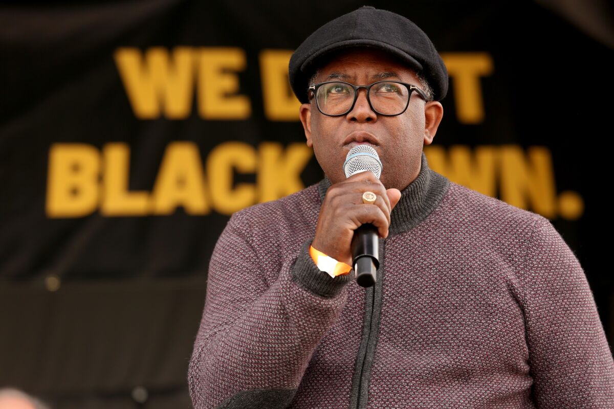 A man speaks into a microphone