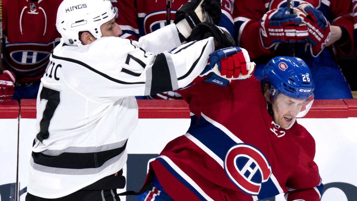 Kings left wing Milan Lucic checks Canadiens defenseman Jeff Petry in the first period Thursday night.