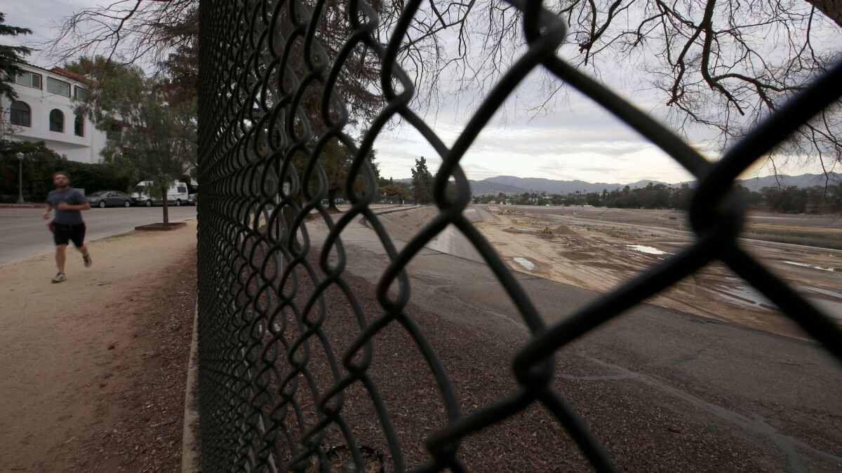 The empty Silver Lake Reservoir, drained as part of a DWP project to bring a new underground reservoir online, has been an eyesore for a year.