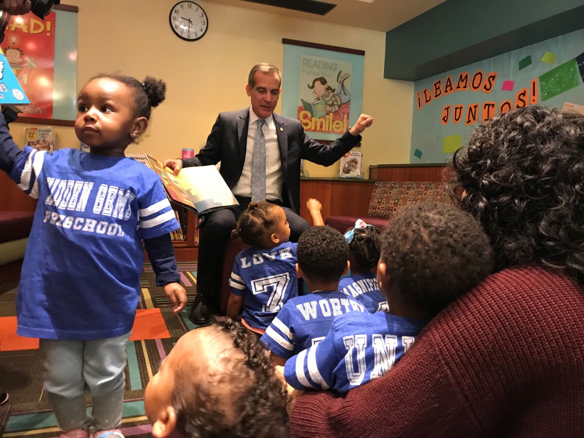 Mayor Eric Garcetti reads to children at the Central Library