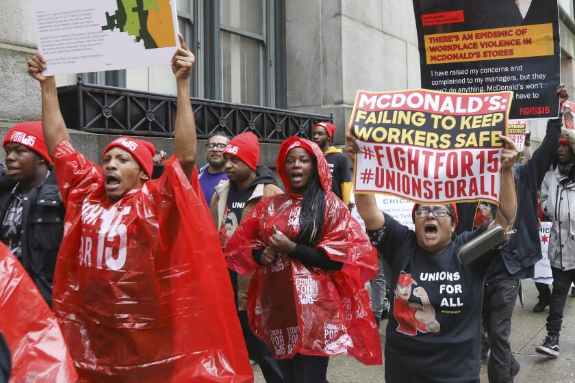 McDonald's employees protest outside City Hall in Chicago on Thursday, Nov. 21, 2019. A group of employees of 13 McDonald's has filed a lawsuit alleging that the company's drive for profits puts workers at risk of physical attack by dangerous customers. (AP Photo/Teresa Crawford)