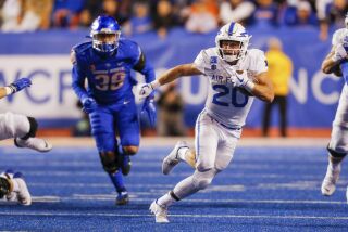 Air Force running back Brad Roberts (20) runs with the ball against Boise State during the second half of an NCAA college football game Saturday, Oct. 16, 2021, in Boise, Idaho. Air Force won 24-17. (AP Photo/Steve Conner)