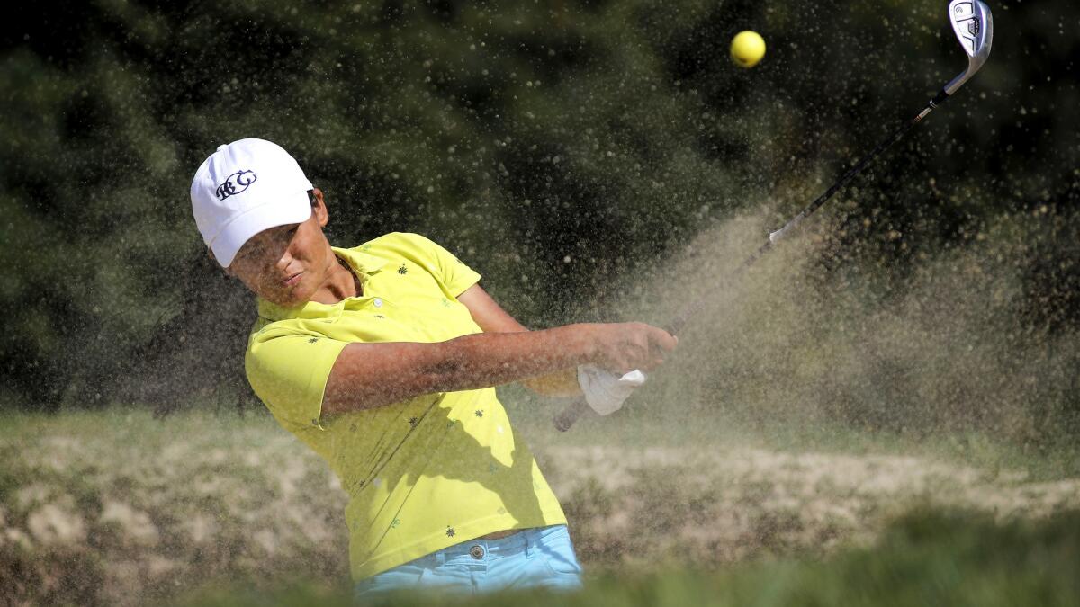 Pratima Sherpa blasts out of a sand trap at Tierra Rejada Golf Club.