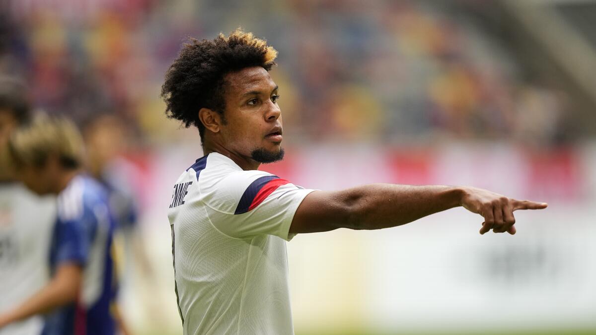 American Weston McKennie points across the field ahead of a match against Japan in Duesseldorf, Germany
