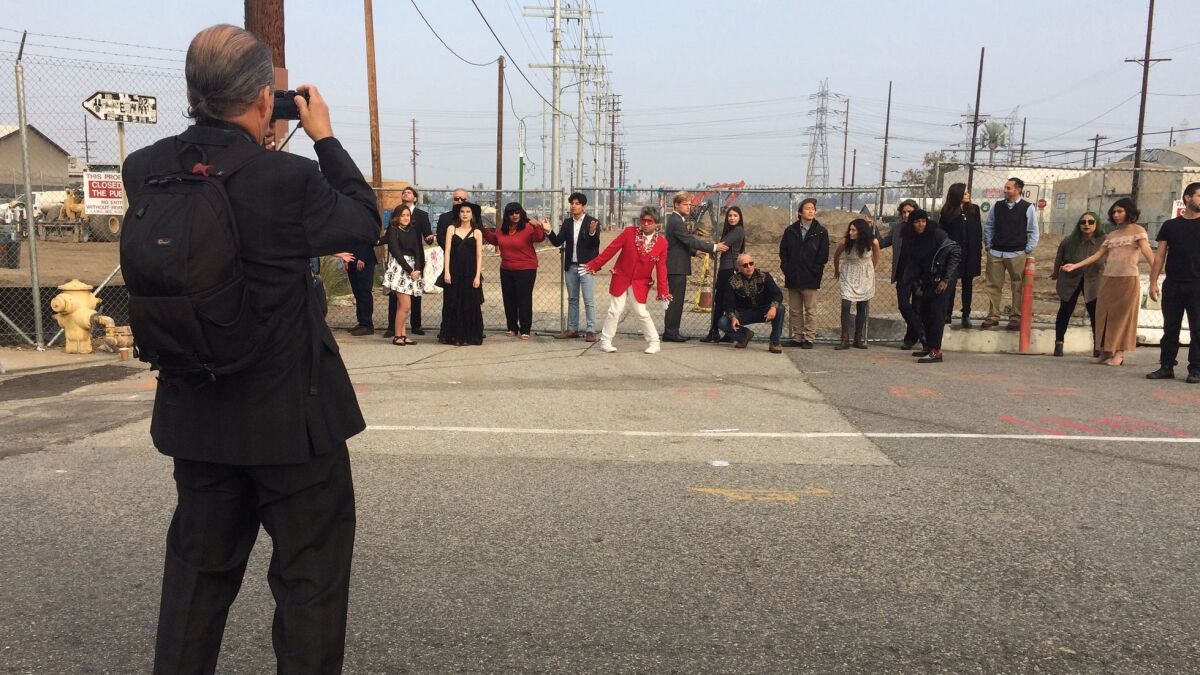 Harry Gamboa Jr. photographs Virtual Verité performers at the foot of the 6th Street Bridge.