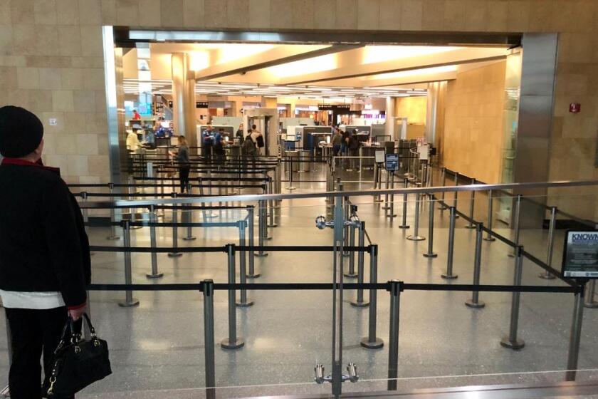 A virtually empty TSA line at the San Diego International Airport on Thursday morning, March 12, 2020.