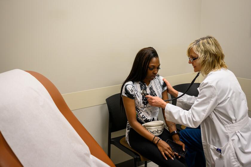 West Memphis, Ark. - Verse Collins, 28, left, of West Memphis, Ark., goes through an examination with Family Nurse Practitioner, Ellen Speak, during a routine checkup at the East Arkansas Family Health Center in West Memphis, Ark. on Friday March 6, 2019. CREDIT: William DeShazer