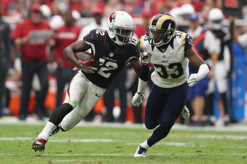 Rams cornerback E.J. Gaines (33) runs after Cardinals receiver John Brown (12) following a reception in the second quarter on Oct. 2.