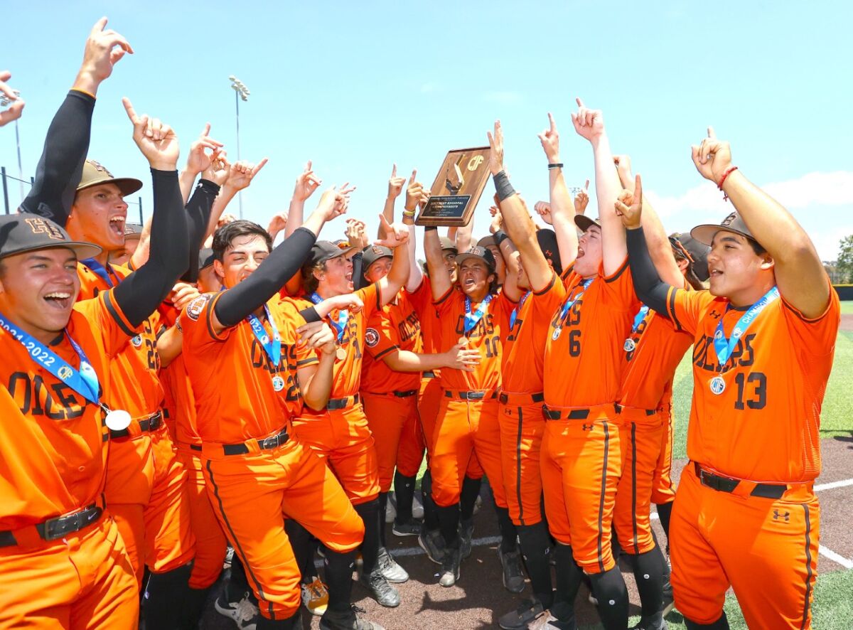 Huntington Beach players celebrate their Division I regional title.