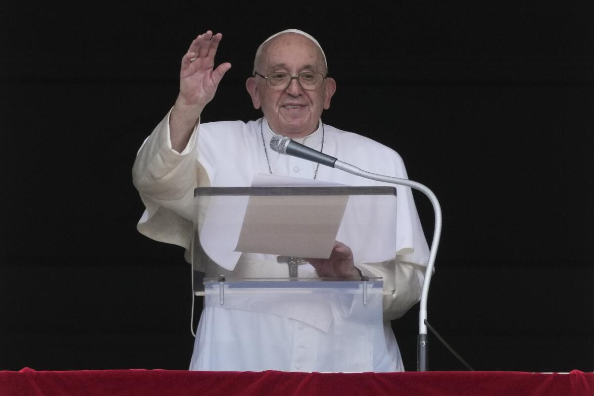 Pope Francis delivers his blessing as he recites the Angelus noon prayer from the window of his studio overlooking St.Peter's Square, at the Vatican, Sunday, Sept. 11, 2022. (AP Photo/Andrew Medichini)