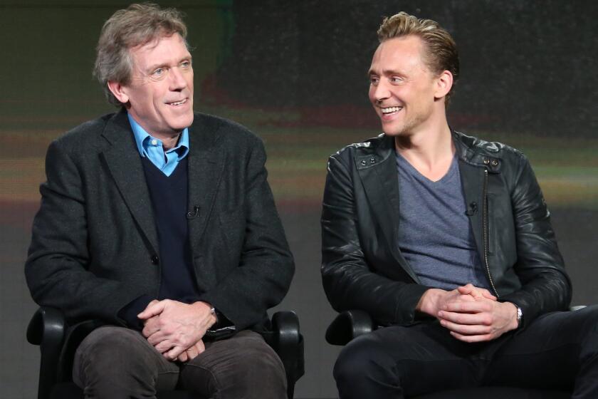 Hugh Laurie, left, and Tom Hiddleston talk about their new miniseries, AMC's "The Night Manager," on Friday at the Television Critics Assn. press tour.