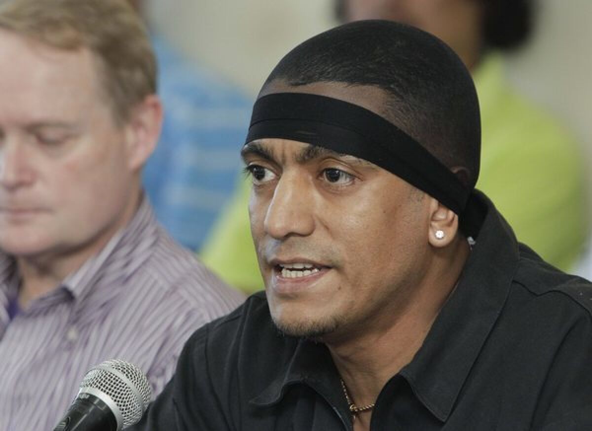 A January 2013 photo shows alleged MS-13 gang leader Borromeo Enrique Henriquez Solorzano at a news conference at a prison in El Salvador. He was named by the U.S. Department of Treasury as a leader of the transnational gang.