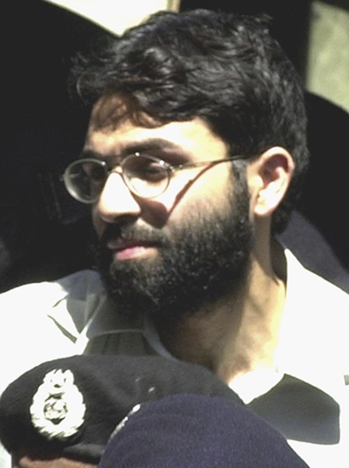 Ahmed Omar Saeed Sheikh outside a courtroom in 2002.