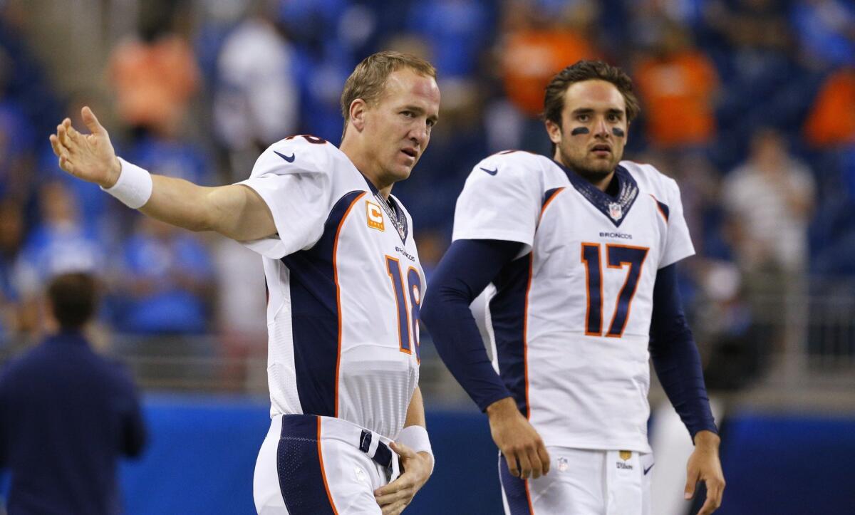 Denver quarterbacks Peyton Manning, left, and Brock Osweiler get ready for the Broncos' game against Detroit on Sept. 27.